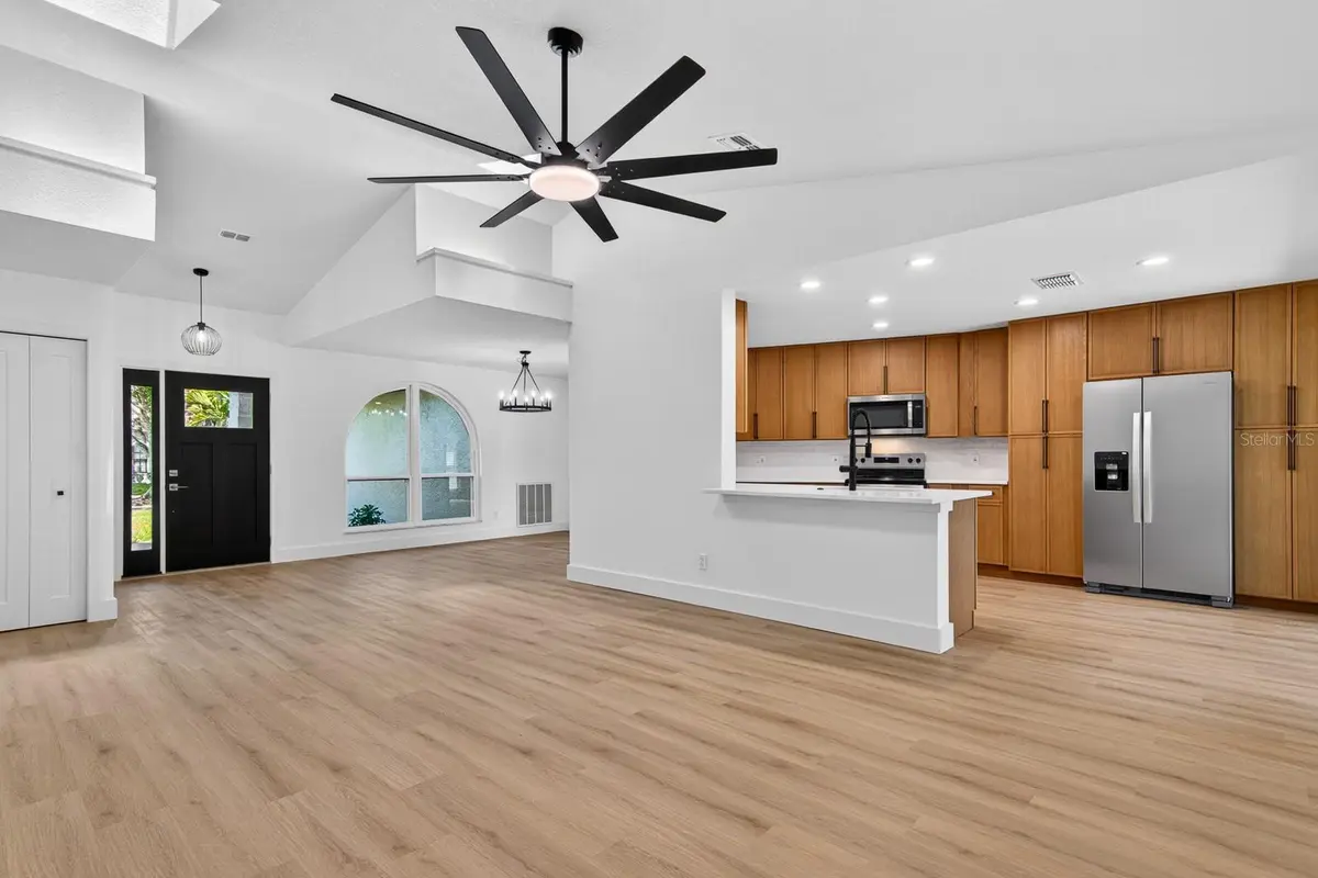 Open living and kitchen interior of a featured Palm Harbor property