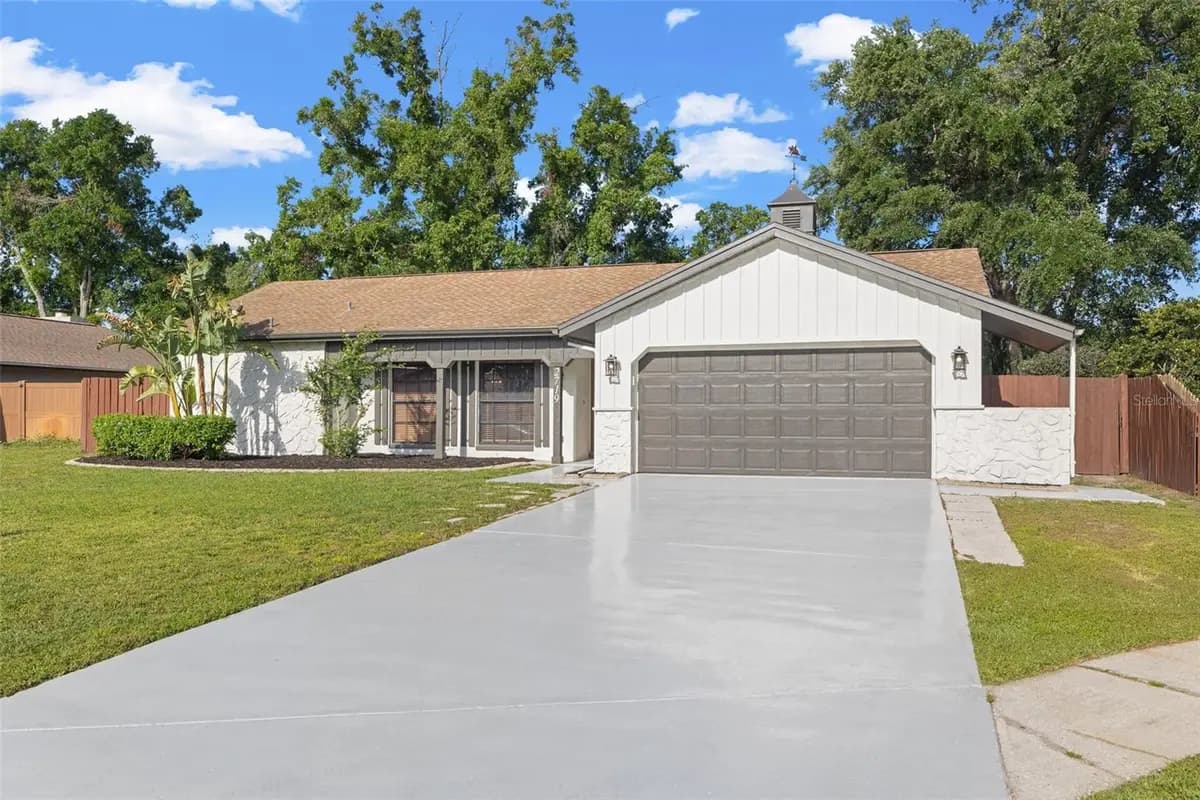 Front exterior of a featured property on Cypress Hollow Court in New Port Richey