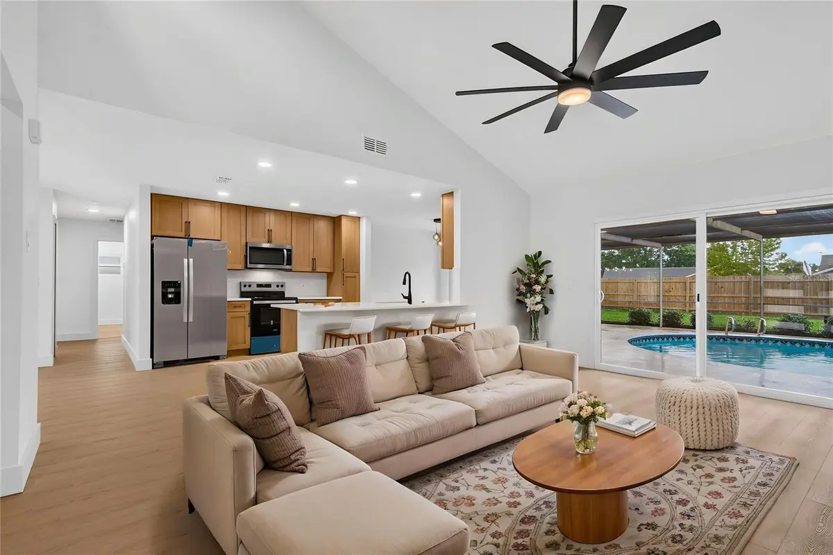 Living room and kitchen interior of a featured Palm Harbor property