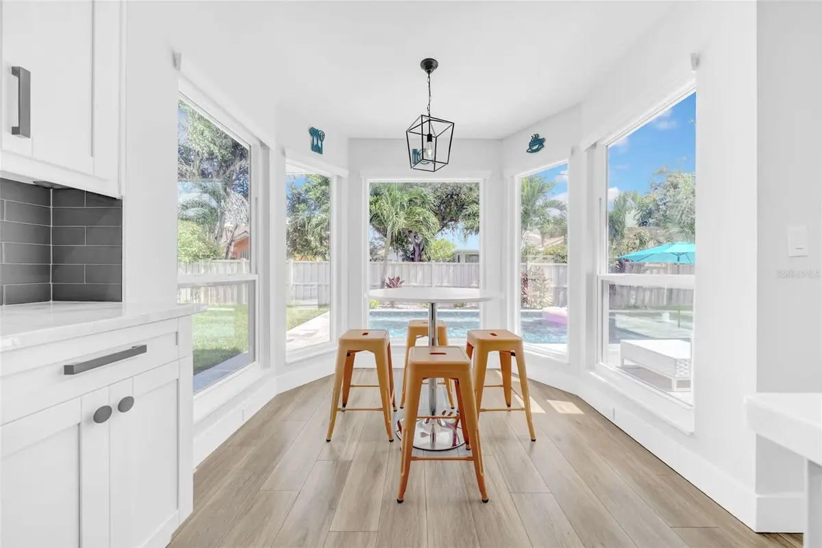 Breakfast area overlooking the pool at a featured St. Petersburg property
