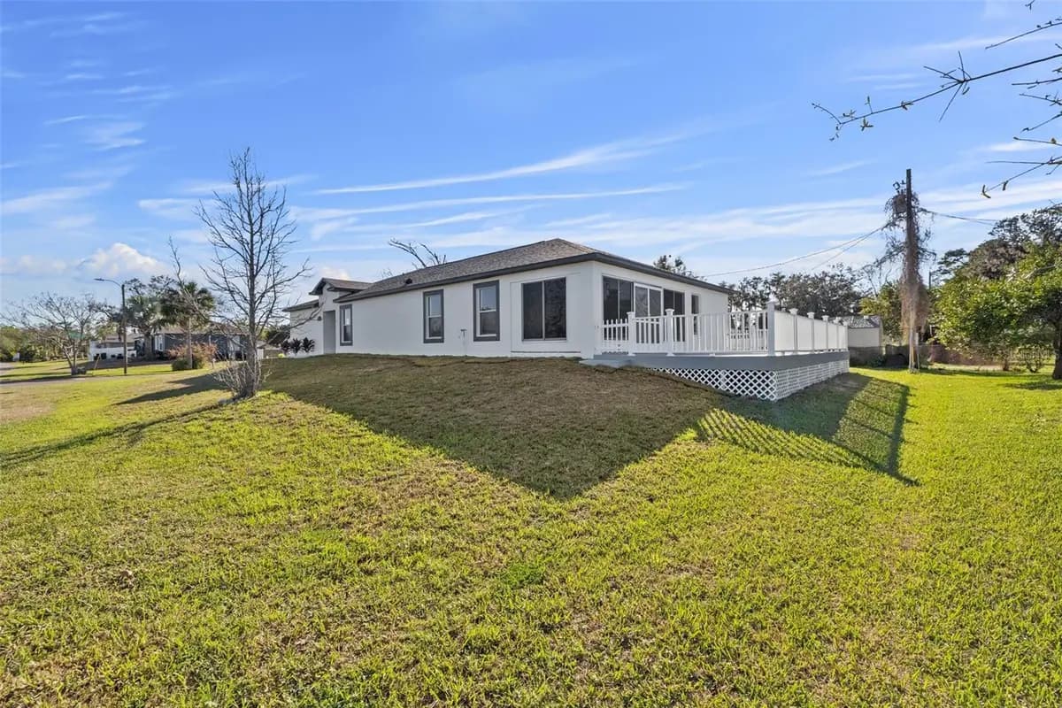 Back exterior and deck of a featured New Port Richey property