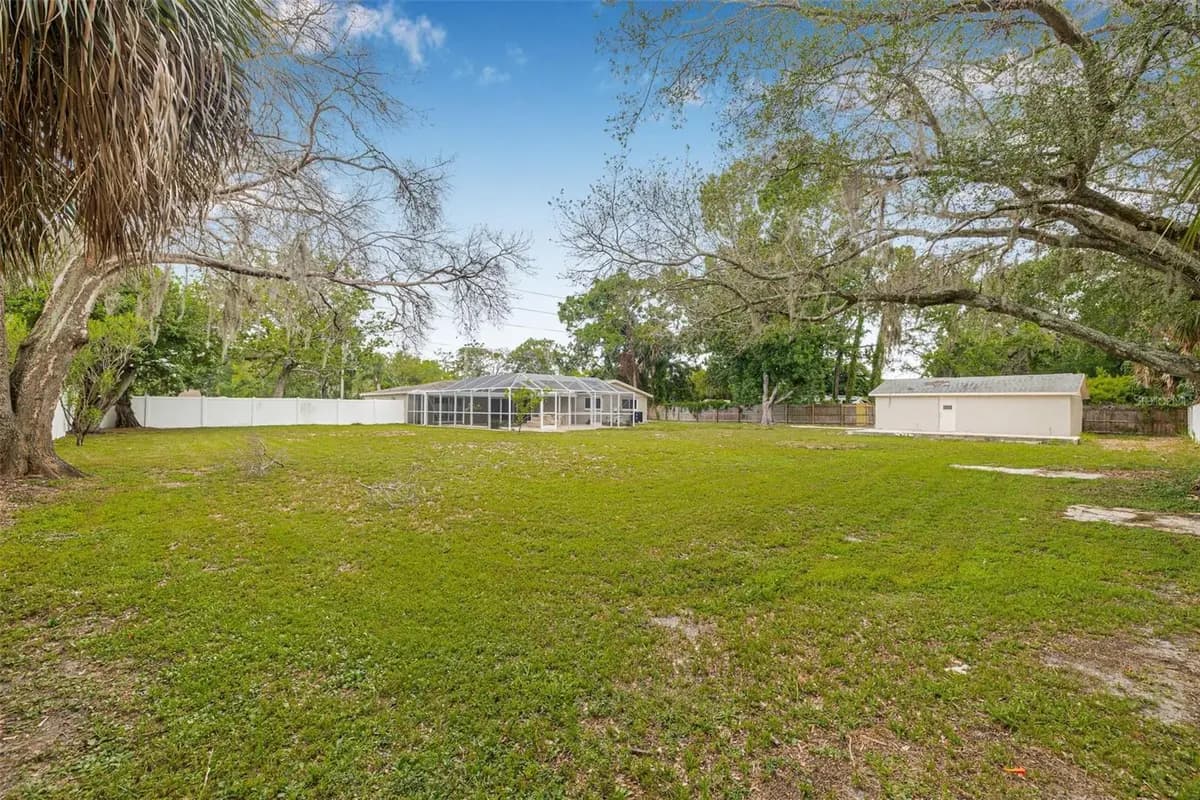 Large backyard view of a featured Hudson property