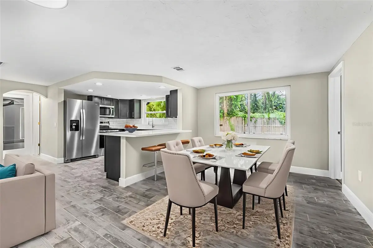 Dining and open kitchen interior of a featured Hudson property